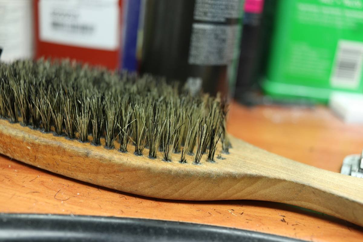 Side-by-side comparison of cellulose acetate, sandalwood, and plastic travel beard combs showing durability and tooth spacing